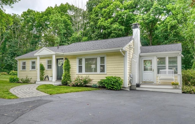 277 Ridgewood Dr, Norwood, MA 02062 - ranch-style home with a chimney and roof with shingles