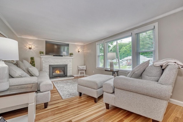 277 Ridgewood Dr, Norwood, MA 02062 - living area with crown molding, light wood finished floors, and a fireplace
