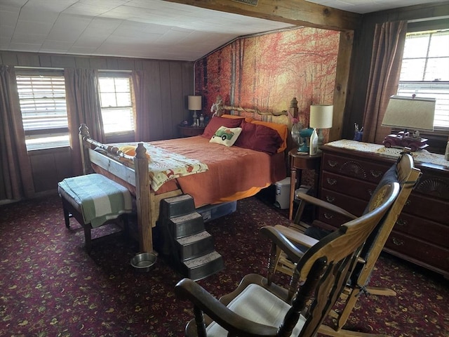 bedroom with carpet and wooden walls