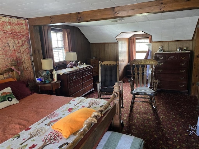bedroom with wood walls, lofted ceiling, and carpet