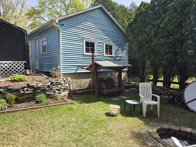 view of side of property with a gazebo and a yard
