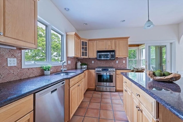 89 Standish Rd, Bourne, MA 02562 - kitchen featuring stainless steel appliances, a sink, light brown cabinetry, light tile patterned floors, and glass insert cabinets