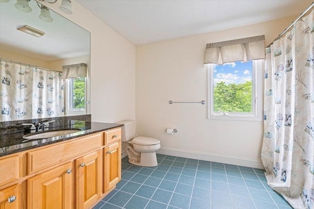 89 Standish Rd, Bourne, MA 02562 - full bath featuring healthy amount of natural light, vanity, toilet, and tile patterned flooring
