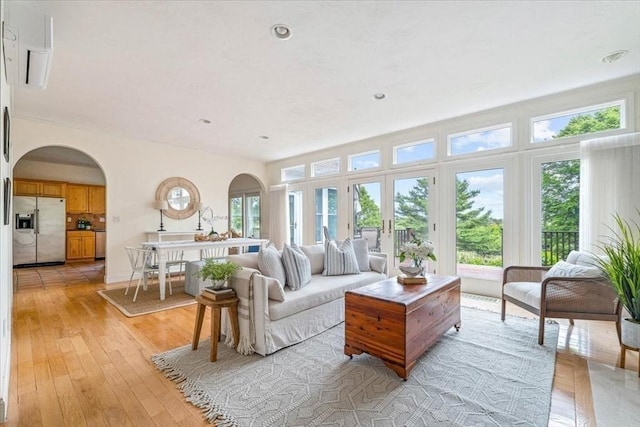 89 Standish Rd, Bourne, MA 02562 - living area featuring arched walkways and light wood finished floors