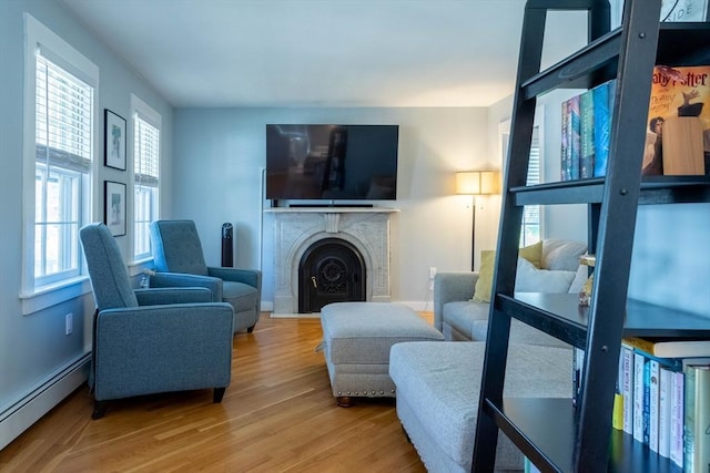 3846 Pawtucket, East Providence, RI 02915 - living room with baseboard heating, wood finished floors, and a fireplace