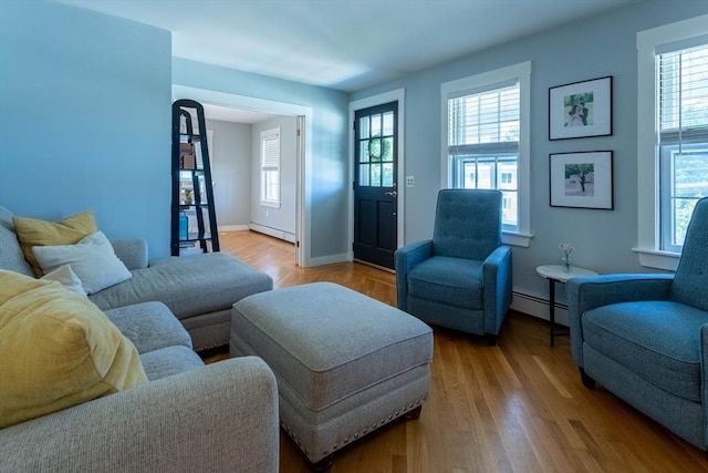3846 Pawtucket, East Providence, RI 02915 - living area featuring a baseboard heating unit and plenty of natural light