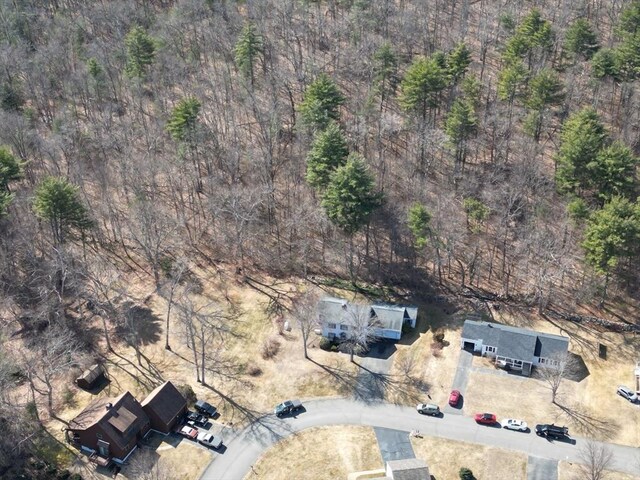 drone / aerial view featuring a forest view