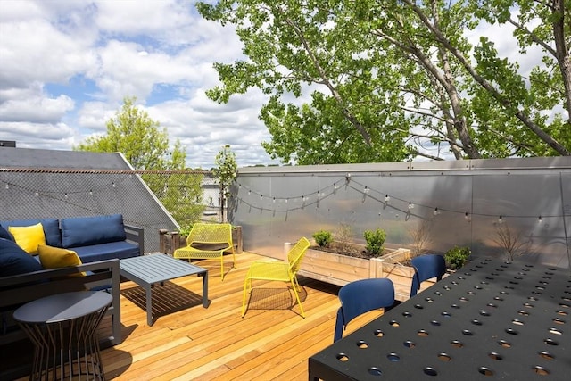 wooden terrace featuring outdoor lounge area