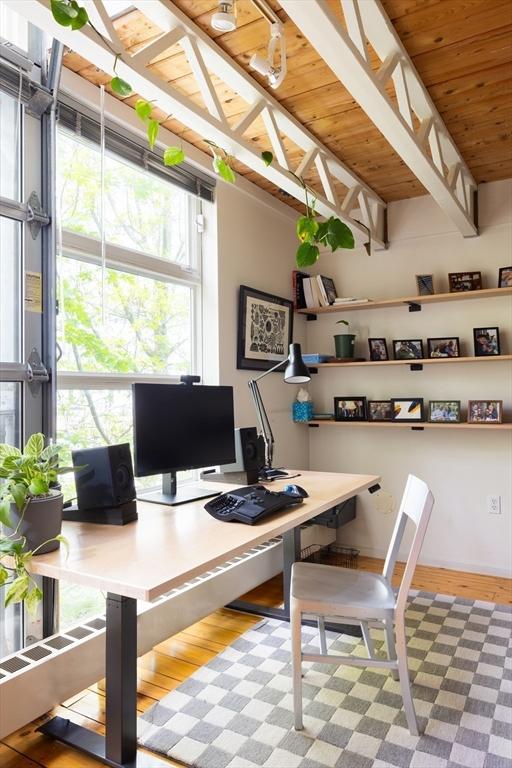 office with wood ceiling, wood finished floors, and beamed ceiling