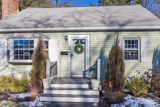 view of snow covered property entrance