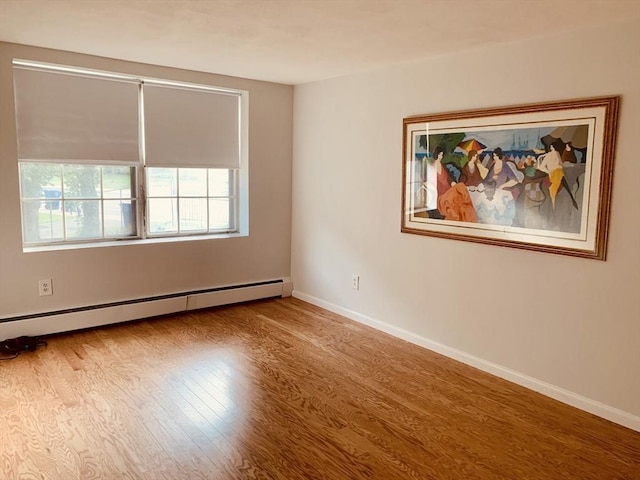 5 Woodsum Dr Unit 7, Braintree, MA 02184 - unfurnished room featuring a baseboard heating unit, wood finished floors, and baseboards
