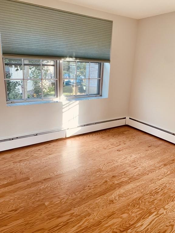 5 Woodsum Dr Unit 7, Braintree, MA 02184 - empty room with wood finished floors