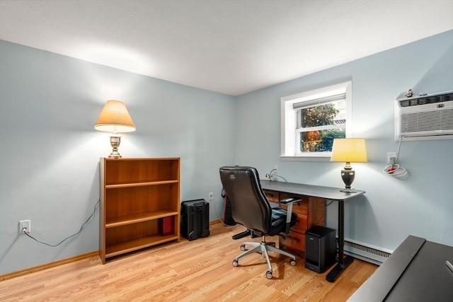 office with a baseboard radiator, a wall mounted AC, and light wood finished floors