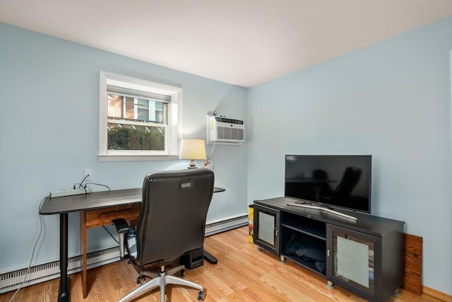 office featuring a wall mounted air conditioner, a baseboard heating unit, baseboard heating, and wood finished floors