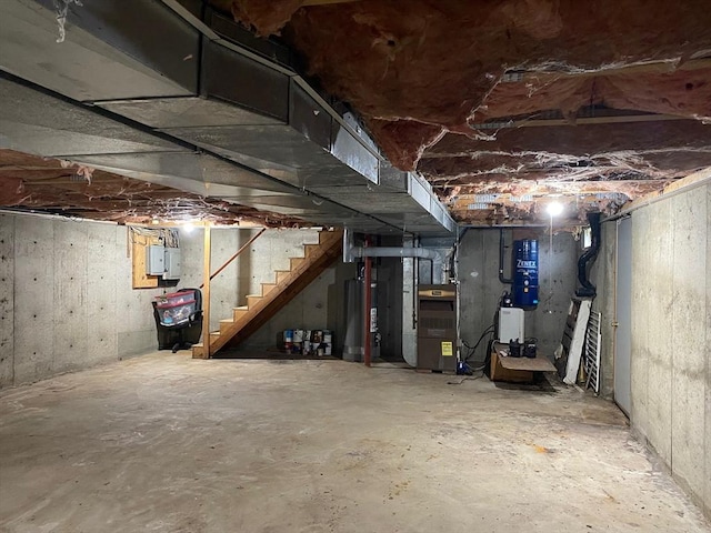 14 Plain Rd E Unit B, Deerfield, MA 01373 - unfinished below grade area with water heater, stairway, heating unit, electric panel, and a central vacuum unit