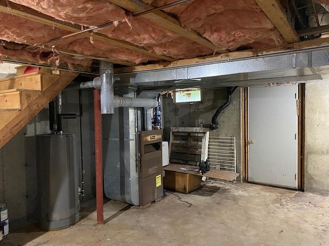 14 Plain Rd E Unit B, Deerfield, MA 01373 - unfinished basement with water heater, heating unit, and stairs