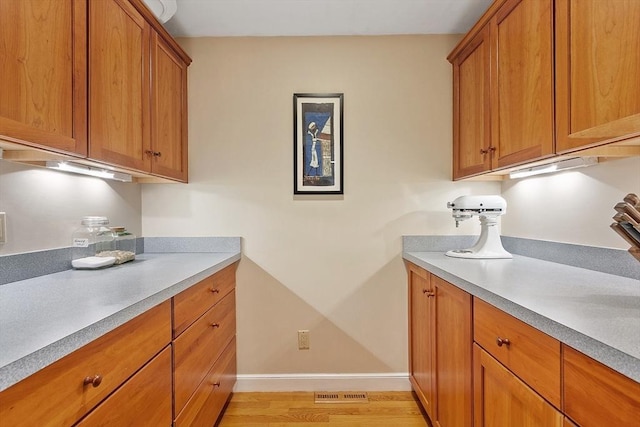 114 Hunters Ridge Rd, Concord, MA 01742 - washroom with light wood-style flooring and baseboards