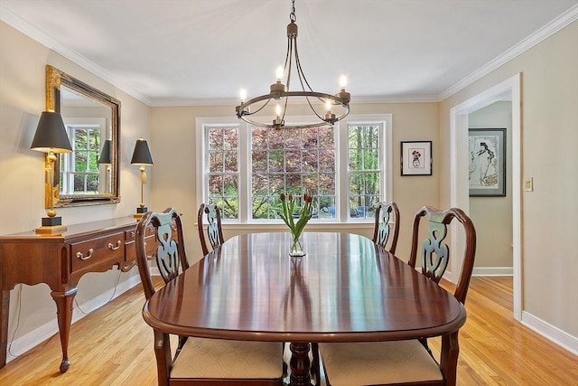 114 Hunters Ridge Rd, Concord, MA 01742 - dining space featuring a chandelier, light wood-style floors, ornamental molding, and baseboards