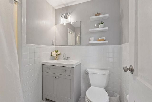 114 Hunters Ridge Rd, Concord, MA 01742 - full bath featuring toilet, tile walls, vanity, and a wainscoted wall
