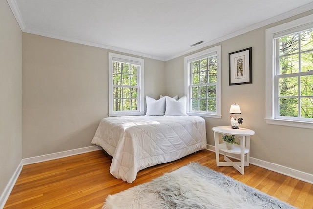 114 Hunters Ridge Rd, Concord, MA 01742 - bedroom with crown molding, baseboards, and wood finished floors