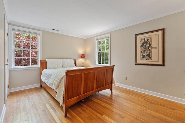 114 Hunters Ridge Rd, Concord, MA 01742 - bedroom with baseboards, light wood-style flooring, and crown molding