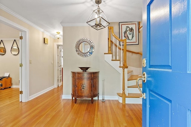114 Hunters Ridge Rd, Concord, MA 01742 - foyer entrance featuring light wood-type flooring, baseboards, stairs, and ornamental molding