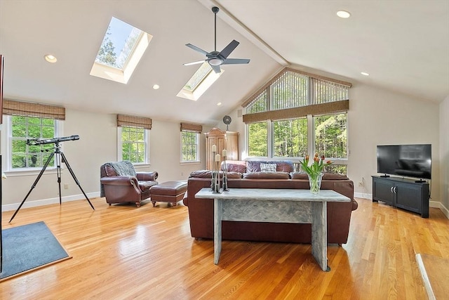 114 Hunters Ridge Rd, Concord, MA 01742 - living room featuring a skylight, light wood-style flooring, baseboards, ceiling fan, and recessed lighting