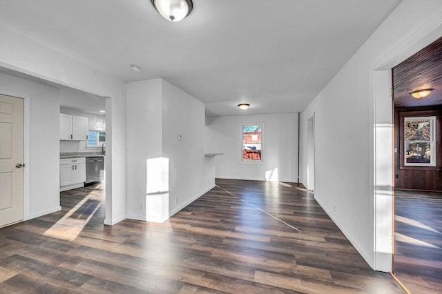 unfurnished living room featuring dark hardwood / wood-style flooring