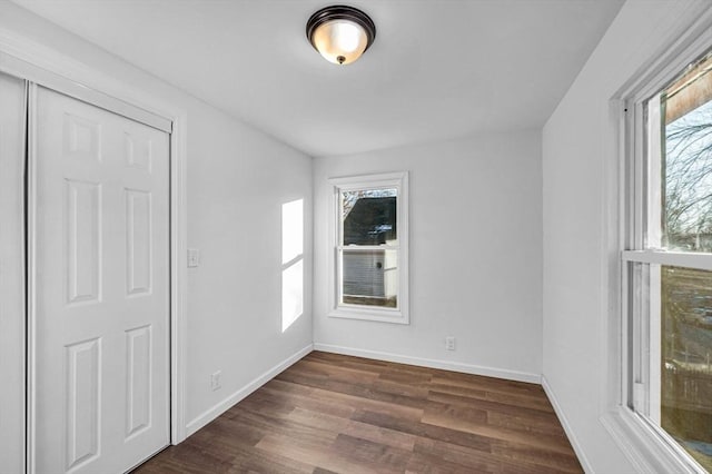 empty room featuring dark hardwood / wood-style floors