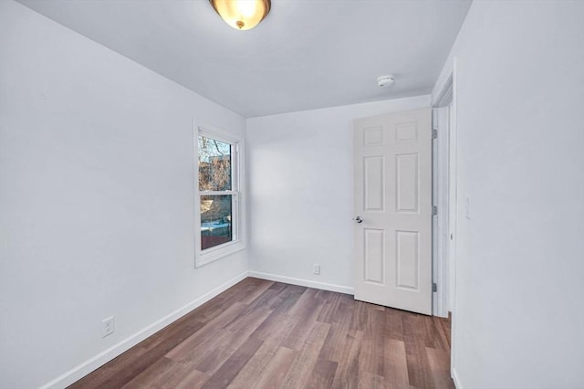 spare room featuring hardwood / wood-style flooring