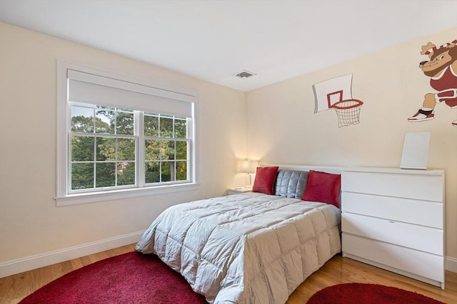 bedroom featuring hardwood / wood-style floors