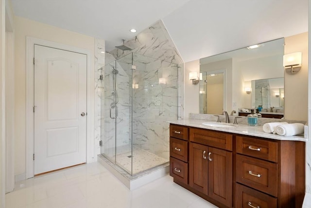 bathroom with tile patterned flooring, vanity, and an enclosed shower