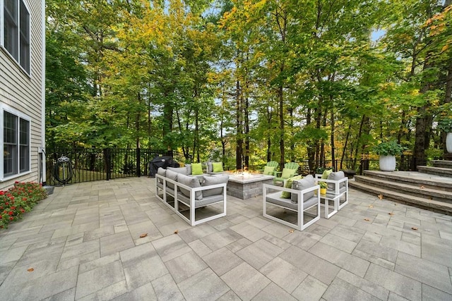 view of patio / terrace featuring a fire pit