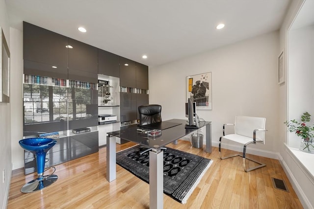 office space with light hardwood / wood-style floors