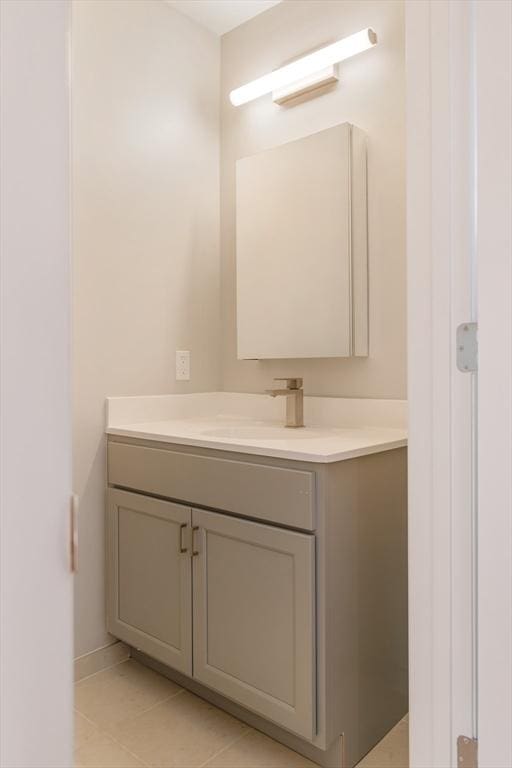 bathroom with tile patterned floors and vanity