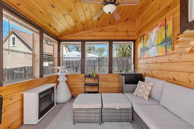 sunroom / solarium with an outdoor living space, a healthy amount of sunlight, wooden ceiling, and vaulted ceiling