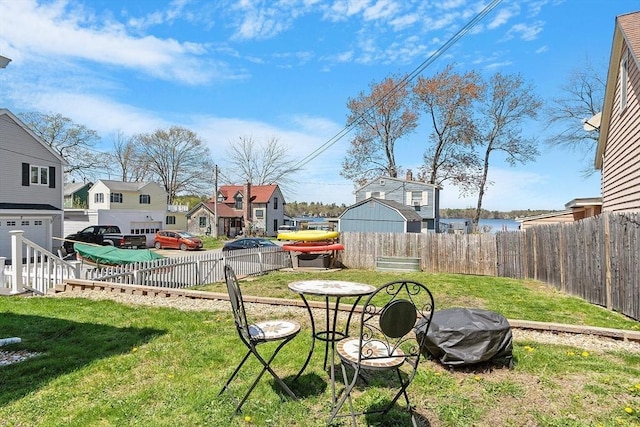 view of yard with a residential view and fence