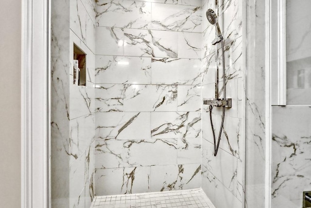 bathroom with tiled shower