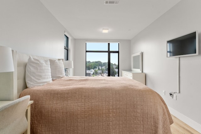 bedroom featuring light wood-type flooring