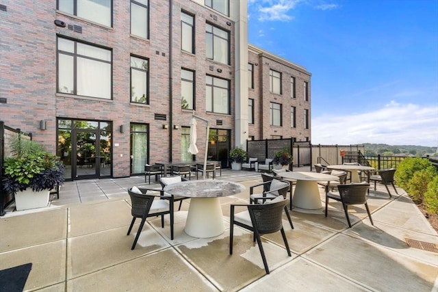 view of patio / terrace featuring outdoor dining area and fence