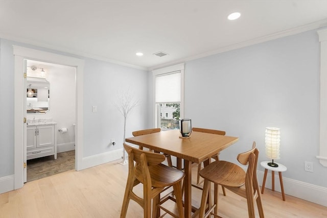 23 Union St Unit 2, Salem, MA 01970 - dining space with light wood finished floors, ornamental molding, and recessed lighting