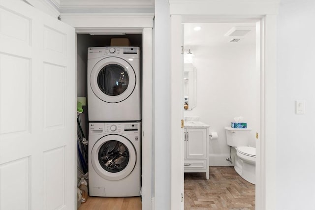 23 Union St Unit 2, Salem, MA 01970 - laundry area featuring estacked washer and dryer and ornamental molding