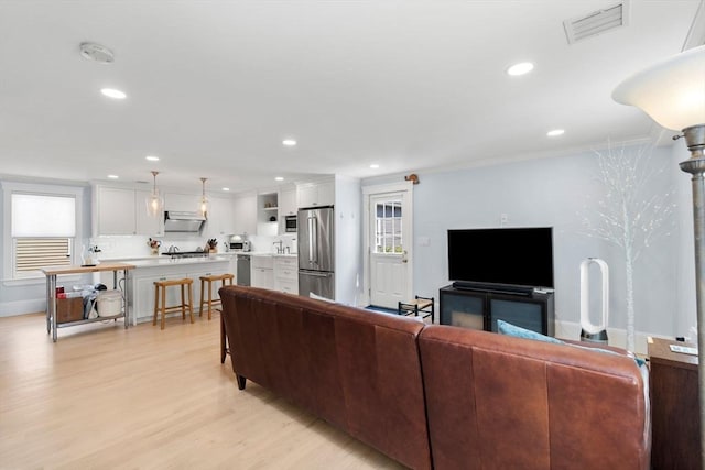 23 Union St Unit 2, Salem, MA 01970 - living room with light wood-style floors, crown molding, and recessed lighting