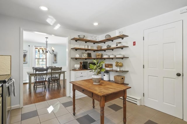 dining space with a chandelier, recessed lighting, baseboard heating, and light tile patterned floors