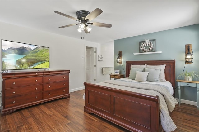 bedroom featuring ceiling fan, dark wood finished floors, and baseboards