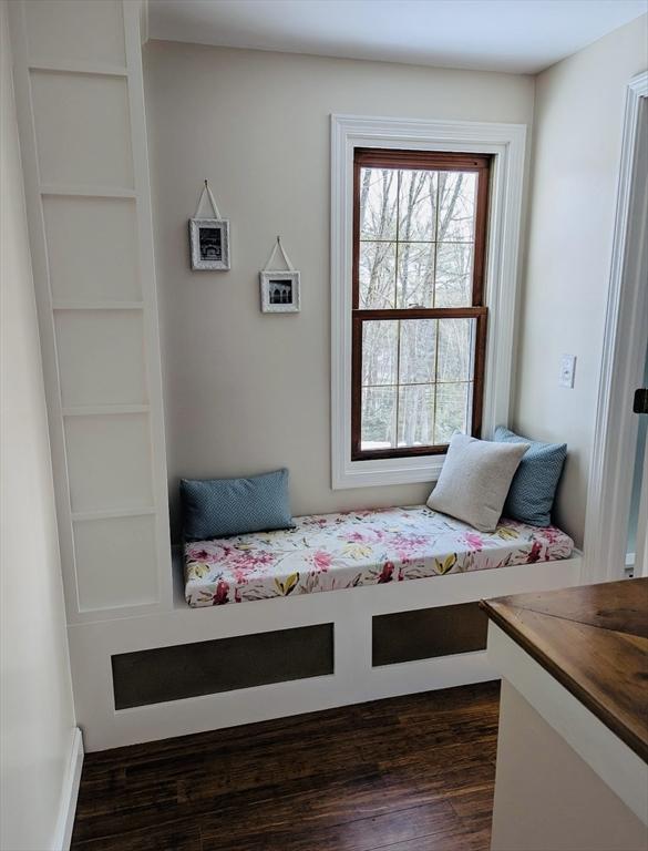 bedroom with dark wood finished floors