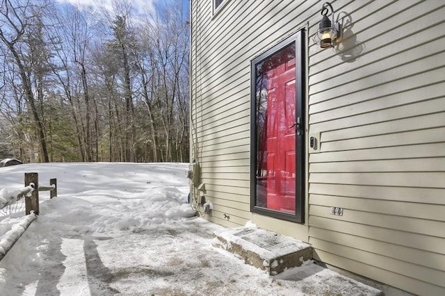 view of snow covered property entrance