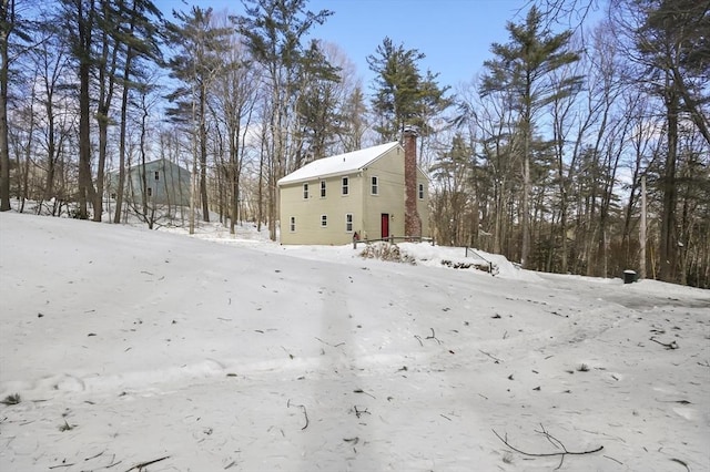 exterior space featuring a chimney