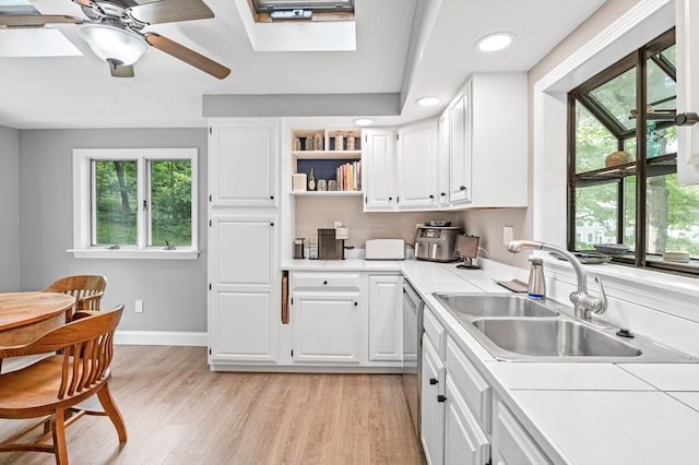 17 High St, Merrimac, MA 01860 - kitchen with a sink, stainless steel dishwasher, healthy amount of natural light, white cabinets, and recessed lighting