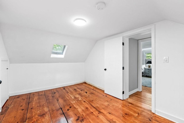 17 High St, Merrimac, MA 01860 - additional living space featuring a skylight, vaulted ceiling, light wood-type flooring, and baseboards